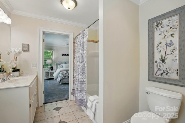 bathroom with crown molding, tile patterned floors, and toilet