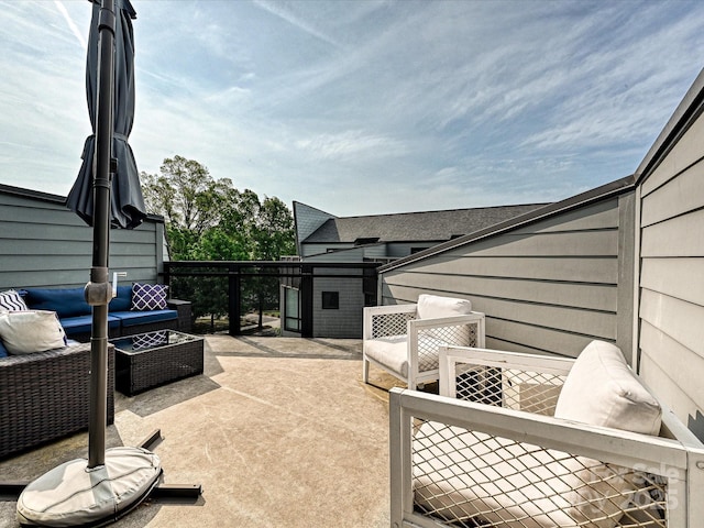 view of patio / terrace with a shed, an outdoor structure, and outdoor lounge area