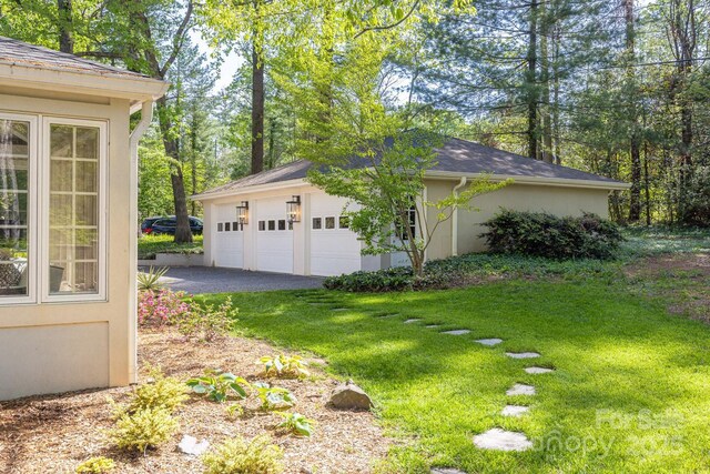 exterior space with a lawn and stucco siding