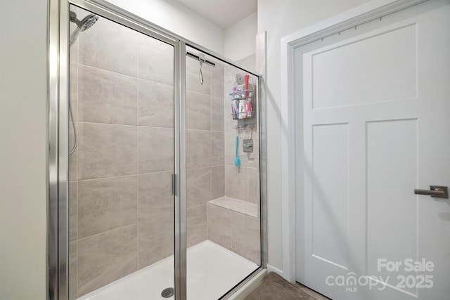 bathroom with a shower stall