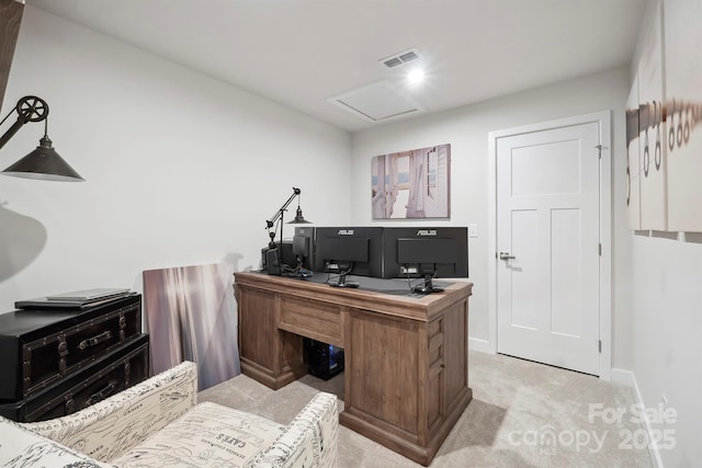 office with baseboards, visible vents, light carpet, and attic access