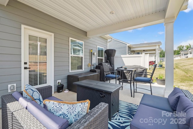 view of patio / terrace with outdoor lounge area and fence