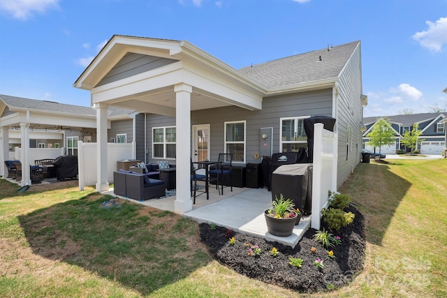 rear view of house featuring fence, an outdoor hangout area, a yard, a patio, and a shingled roof