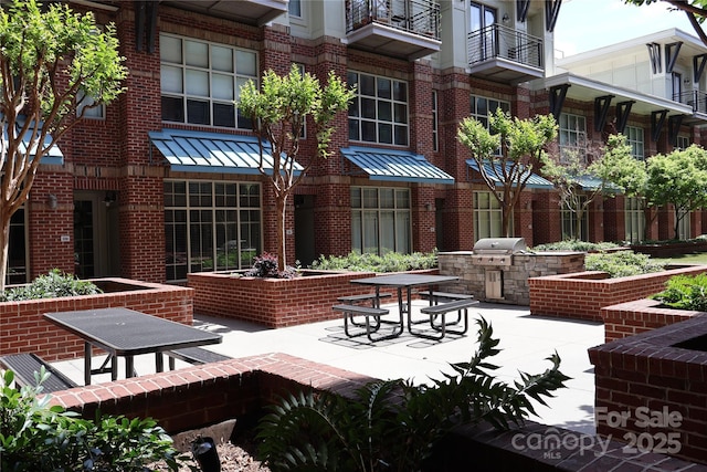1101 W 1st St Unit 408, Charlotte, NC 28202 - view of home's community featuring exterior kitchen and a patio area