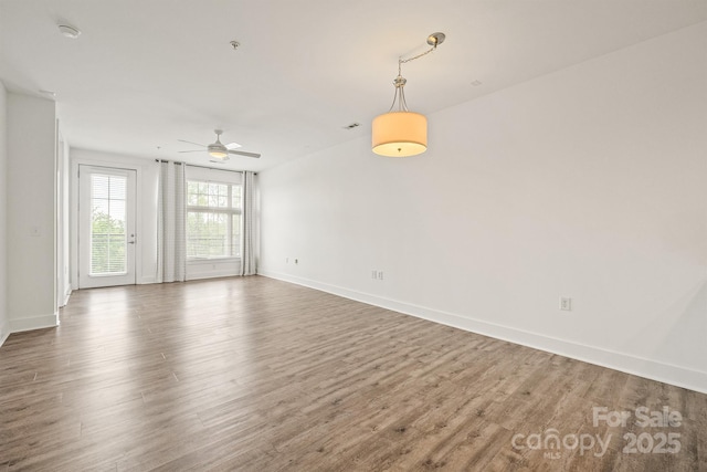 1101 W 1st St Unit 408, Charlotte, NC 28202 - empty room with a ceiling fan, wood finished floors, baseboards, and a smoke detector