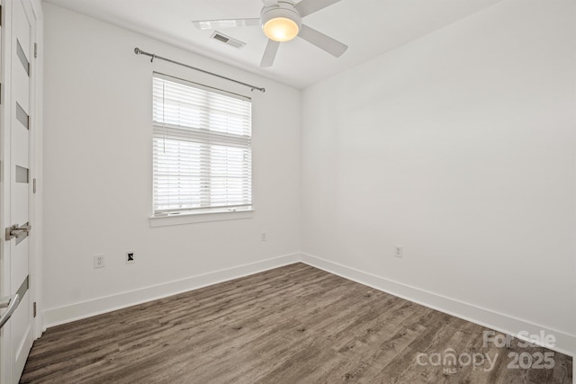 1101 W 1st St Unit 408, Charlotte, NC 28202 - empty room featuring dark wood-style flooring, a ceiling fan, and baseboards