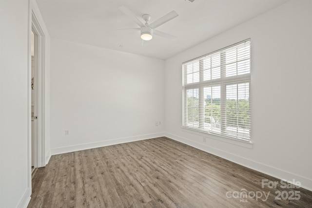 1101 W 1st St Unit 408, Charlotte, NC 28202 - spare room with wood finished floors, baseboards, and a ceiling fan