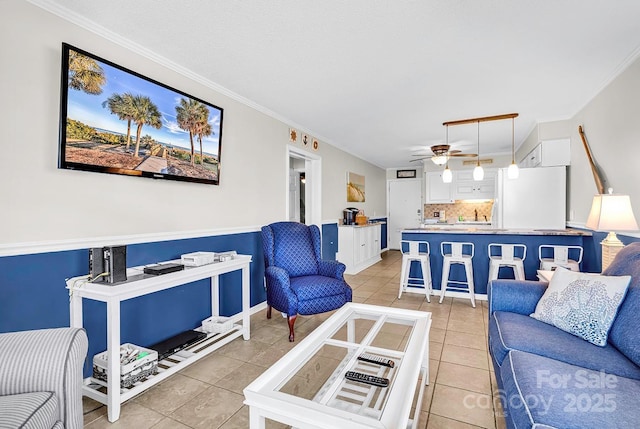 9660 Shore Dr Unit 208, Myrtle Beach, SC 29572 - living room featuring light tile patterned floors, baseboards, ceiling fan, and ornamental molding