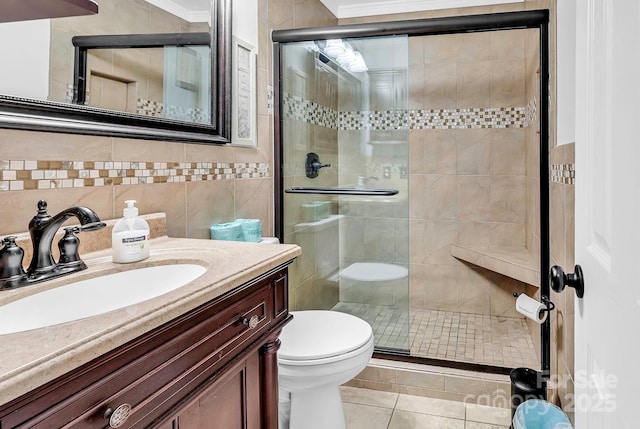 9660 Shore Dr Unit 208, Myrtle Beach, SC 29572 - bathroom featuring crown molding, a stall shower, toilet, and tile walls