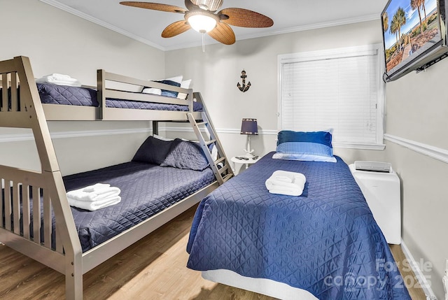 9660 Shore Dr Unit 208, Myrtle Beach, SC 29572 - bedroom with crown molding, a ceiling fan, and wood finished floors