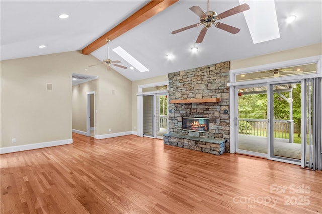 1760 Jacobs Way, Sherrills Ford, NC 28673 - unfurnished living room with a skylight, a ceiling fan, plenty of natural light, beam ceiling, and high vaulted ceiling