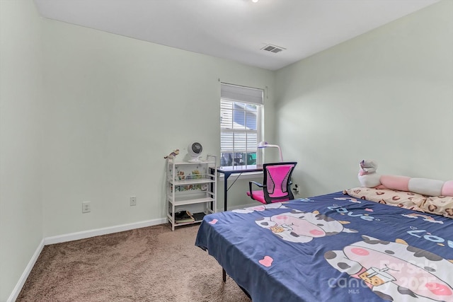 carpeted bedroom with baseboards
