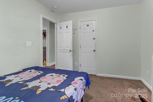 carpeted bedroom with baseboards
