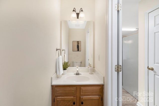 bathroom featuring toilet and vanity