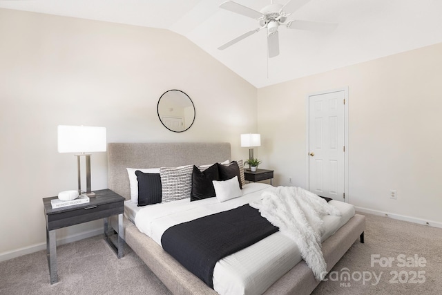 carpeted bedroom featuring baseboards, ceiling fan, and lofted ceiling