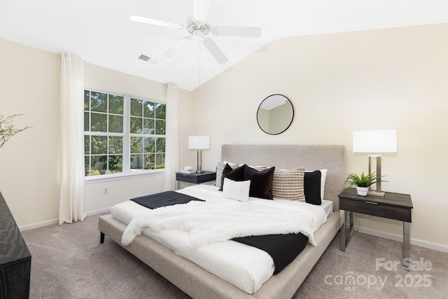 carpeted bedroom featuring a ceiling fan, baseboards, visible vents, and vaulted ceiling
