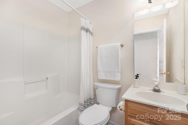 full bath with vanity, shower / bath combo with shower curtain, and toilet