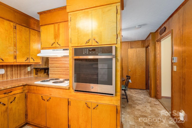 115 Patterson Rd, Kings Mountain, NC 28086 - kitchen featuring oven, under cabinet range hood, white electric cooktop, light countertops, and brown cabinetry