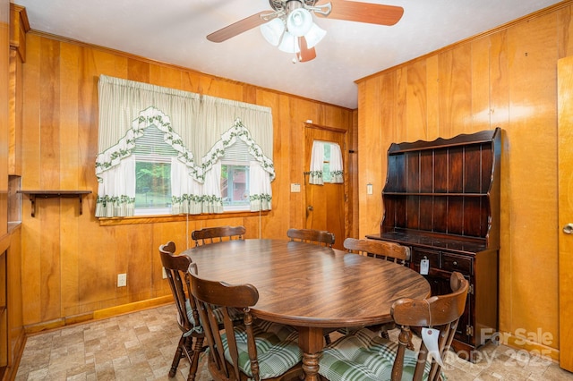 115 Patterson Rd, Kings Mountain, NC 28086 - dining area featuring wooden walls, a ceiling fan, and crown molding