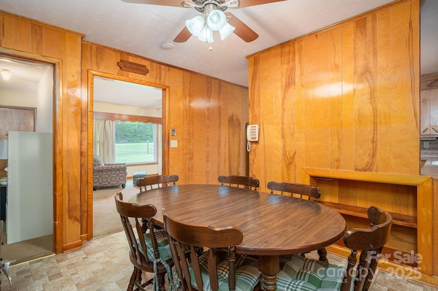 115 Patterson Rd, Kings Mountain, NC 28086 - dining area featuring ceiling fan and wood walls