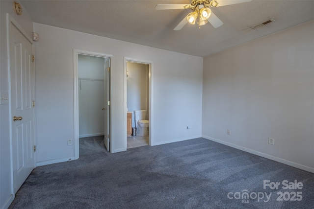 6808 Squirrels Foot Ct, Charlotte, NC 28217 - unfurnished bedroom featuring visible vents, baseboards, a spacious closet, and carpet floors