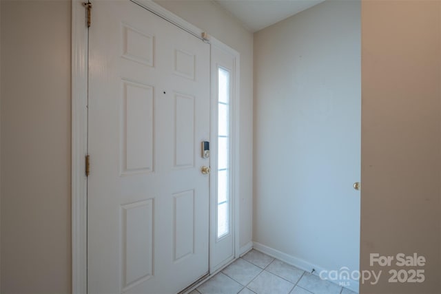 6808 Squirrels Foot Ct, Charlotte, NC 28217 - entryway featuring a wealth of natural light, baseboards, and light tile patterned floors