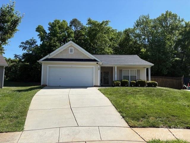 6808 Squirrels Foot Ct, Charlotte, NC 28217 - ranch-style house with a front yard, an attached garage, and driveway