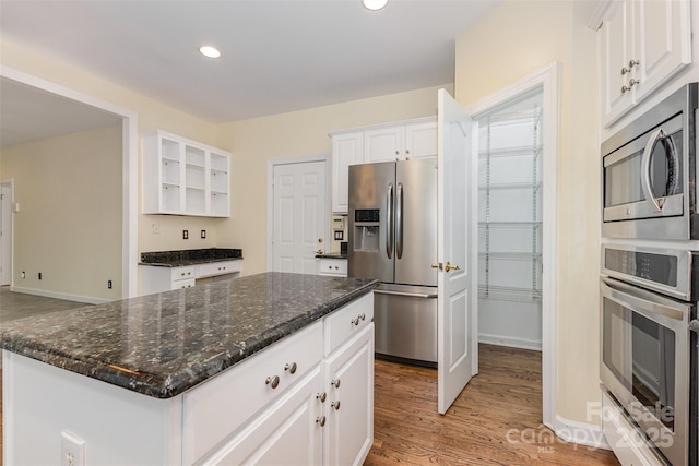 3710 Cheleys Ridge Ln, Charlotte, NC 28270 - kitchen featuring stainless steel appliances, white cabinetry, light wood finished floors, a kitchen island, and recessed lighting