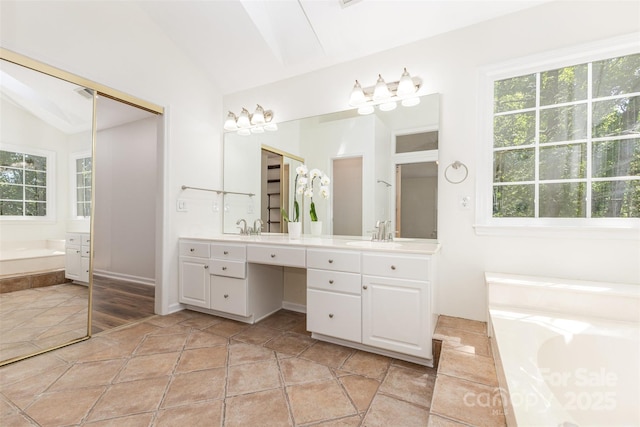 3710 Cheleys Ridge Ln, Charlotte, NC 28270 - full bathroom with vaulted ceiling, a garden tub, and double vanity