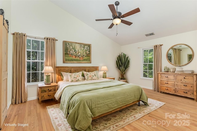 3710 Cheleys Ridge Ln, Charlotte, NC 28270 - bedroom with light wood-type flooring, a barn door, baseboards, high vaulted ceiling, and a ceiling fan