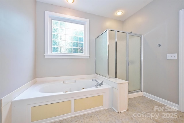 bathroom featuring a tub with jets, tile patterned flooring, and a shower stall