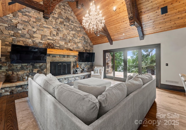 172 Tennessee Cir, Mooresville, NC 28117 - living room with wood ceiling with exposed beams, a fireplace, high vaulted ceiling, a chandelier, and wood finished floors
