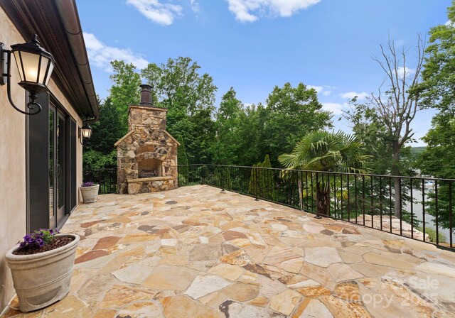 172 Tennessee Cir, Mooresville, NC 28117 - view of patio / terrace with an outdoor stone fireplace