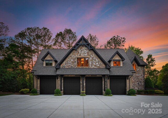 172 Tennessee Cir, Mooresville, NC 28117 - craftsman-style home with stone siding, concrete driveway, and a garage