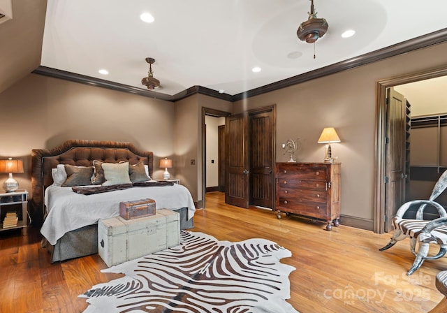 172 Tennessee Cir, Mooresville, NC 28117 - bedroom featuring ornamental molding, wood finished floors, recessed lighting, baseboards, and a closet