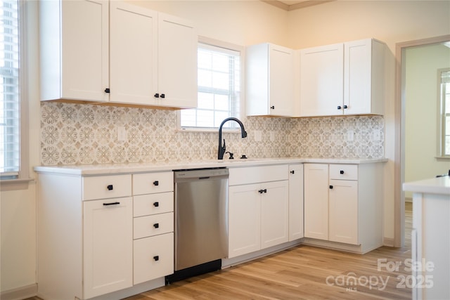133 Water Leaf Dr, Weaverville, NC 28787 - kitchen with dishwasher, light countertops, white cabinets, light wood-style floors, and tasteful backsplash