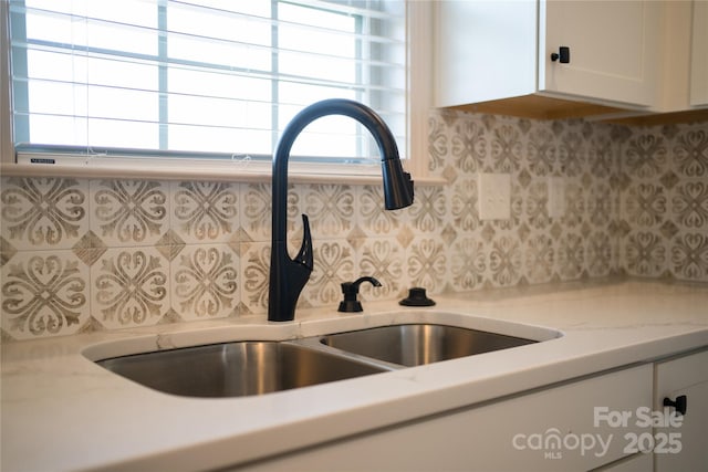 133 Water Leaf Dr, Weaverville, NC 28787 - kitchen view of a sink, decorative backsplash, and white cabinets