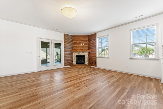 133 Water Leaf Dr, Weaverville, NC 28787 - unfurnished living room with light wood-type flooring, a large fireplace, baseboards, and ornamental molding