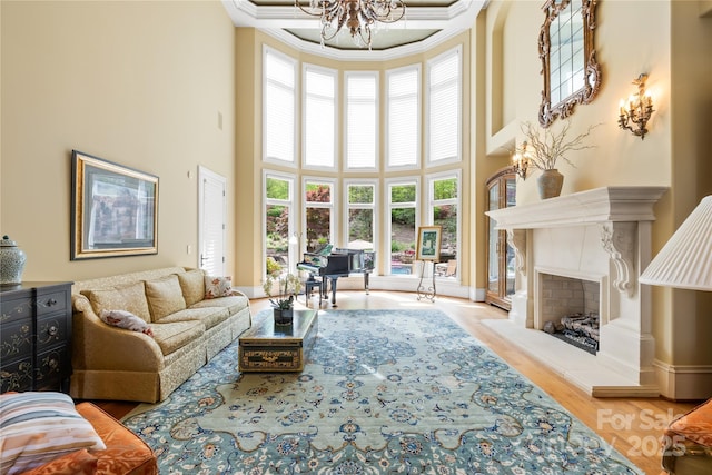 8451 Ridgewood Rd, Sherrills Ford, NC 28673 - living room featuring crown molding, a high ceiling, a chandelier, and a premium fireplace