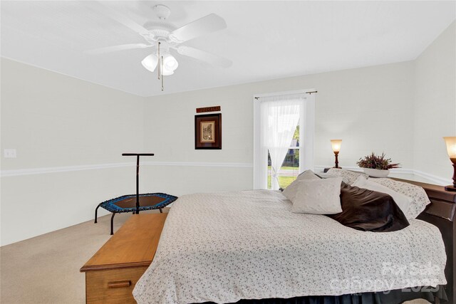bedroom with carpet floors and a ceiling fan
