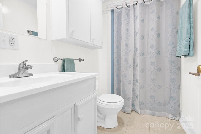 full bathroom with toilet, tile patterned floors, a shower with shower curtain, and vanity