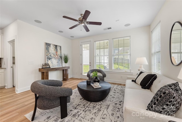 2638 Double Oaks Rd, Charlotte, NC 28206 - living area with light wood-type flooring, baseboards, and a ceiling fan