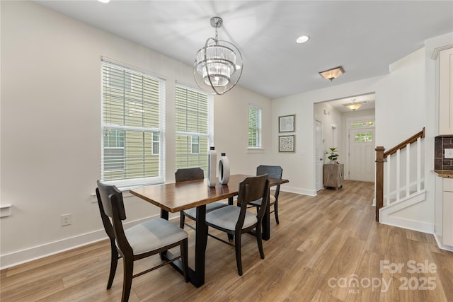 2638 Double Oaks Rd, Charlotte, NC 28206 - dining area with baseboards, light wood finished floors, a chandelier, stairway, and recessed lighting