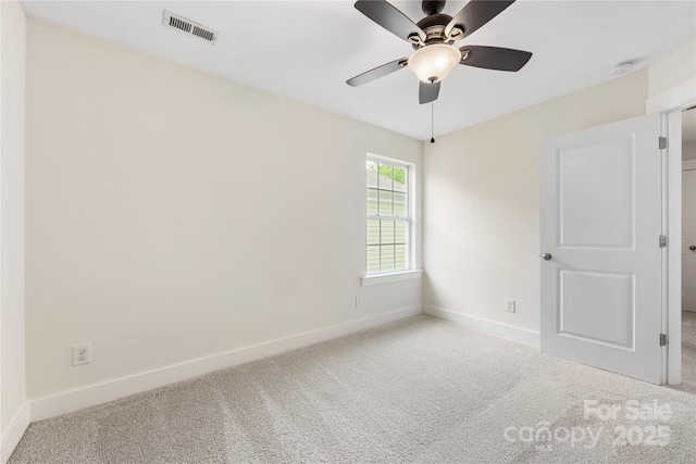 2638 Double Oaks Rd, Charlotte, NC 28206 - carpeted empty room featuring baseboards and a ceiling fan