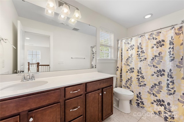 2638 Double Oaks Rd, Charlotte, NC 28206 - full bath featuring tile patterned flooring, toilet, vanity, and healthy amount of natural light