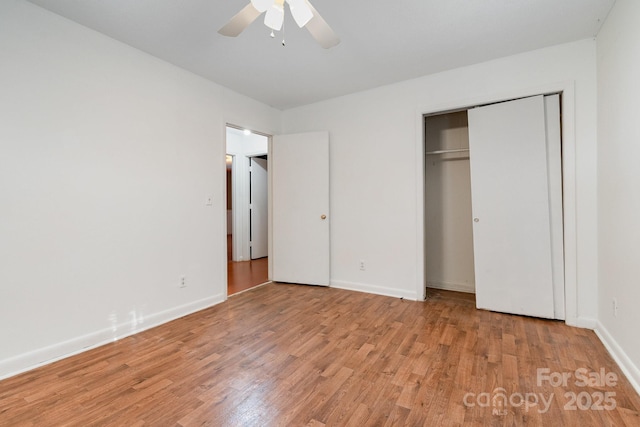 1108 Old Dallas Hwy, Dallas, NC 28034 - unfurnished bedroom with baseboards, a ceiling fan, light wood finished floors, and a closet