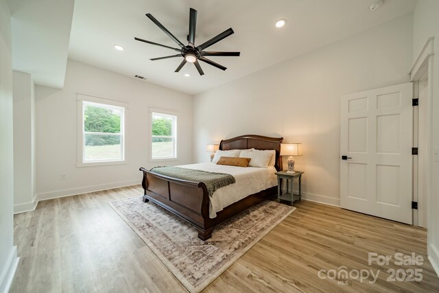 bedroom with light wood-style floors, baseboards, a ceiling fan, and recessed lighting