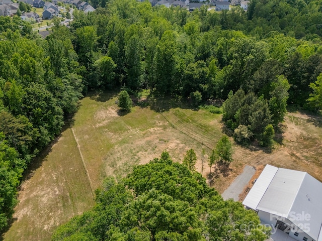 bird's eye view featuring a view of trees