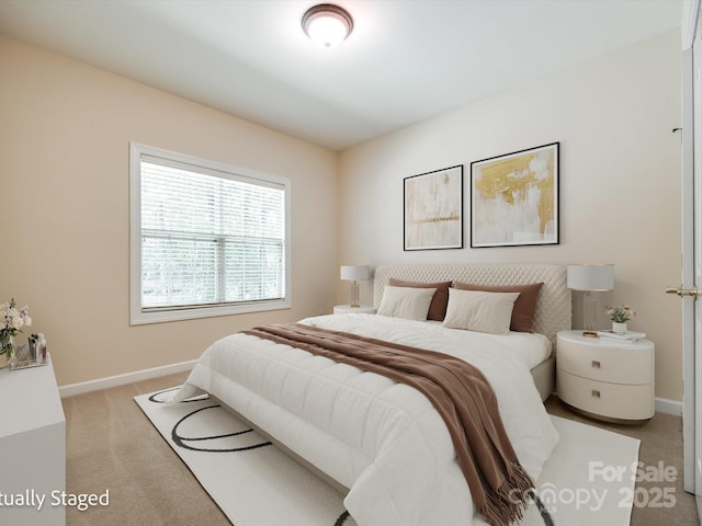 bedroom with baseboards and carpet flooring