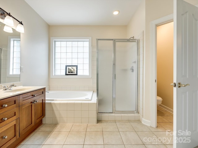 full bathroom with toilet, tile patterned floors, a shower stall, and vanity